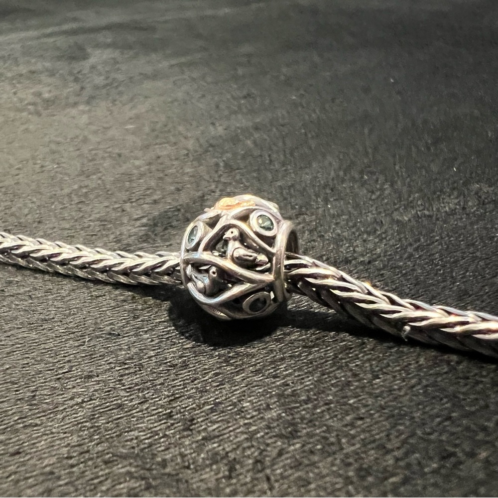 Pandora Retired Birds of a Feather charm with 14k gold, silver, and CZ
